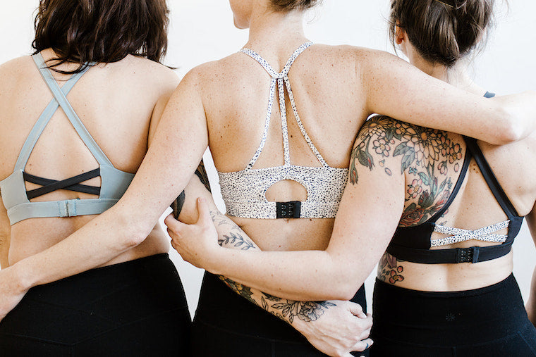 three women wearing Avyn bras seen from behind